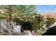 Green backyard space with a well maintained outdoor kitchen under a bright pergola at 5856 Sutcliffe Cir, Las Vegas, NV 89110
