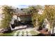 Inviting backyard patio featuring a pergola, outdoor furniture, grill, and lush greenery at 5856 Sutcliffe Cir, Las Vegas, NV 89110