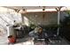 Enchanting backyard patio with a pergola, outdoor grill, dining set, and beautiful landscaping at 5856 Sutcliffe Cir, Las Vegas, NV 89110