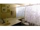 Well-lit bathroom with vanity, large mirror, and shower-tub combination provides a functional and clean space at 5856 Sutcliffe Cir, Las Vegas, NV 89110