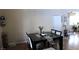 A cozy dining room features a dark wood table set for a meal, offering a warm, inviting atmosphere at 5856 Sutcliffe Cir, Las Vegas, NV 89110