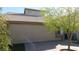 Home's side exterior featuring pavers and a small tree at 5856 Sutcliffe Cir, Las Vegas, NV 89110