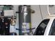 Garage featuring a newer water heater at 5856 Sutcliffe Cir, Las Vegas, NV 89110