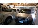 Two cars parked inside a two-car garage with ample storage space at 5856 Sutcliffe Cir, Las Vegas, NV 89110