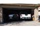 Organized two-car garage featuring a truck and an SUV at 5856 Sutcliffe Cir, Las Vegas, NV 89110