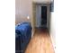 Hallway that leads to bedroom with wooden floor at 5856 Sutcliffe Cir, Las Vegas, NV 89110