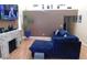 A cozy living room with plush seating, a modern fireplace, and ample natural light offers comfortable relaxation space at 5856 Sutcliffe Cir, Las Vegas, NV 89110