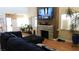 Inviting living room with high ceilings, hardwood floors, and stone fireplace at 5856 Sutcliffe Cir, Las Vegas, NV 89110
