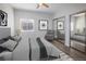 Bedroom featuring a mirrored closet and large windows for natural light at 6160 Rumrill St # 201, Las Vegas, NV 89113