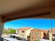 View of community buildings and parking from the unit's patio at 6160 Rumrill St # 201, Las Vegas, NV 89113