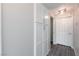 Hallway with storage cabinets, neutral walls and gray wood-look floors at 6160 Rumrill St # 201, Las Vegas, NV 89113