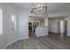 Open concept living space with a kitchen, hardwood floors, and natural light at 6160 Rumrill St # 201, Las Vegas, NV 89113