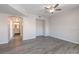 Neutral-toned living room with ceiling fan, hard wood floors, and an open archway to bathroom at 6160 Rumrill St # 201, Las Vegas, NV 89113