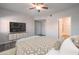 Main bedroom featuring a ceiling fan, neutral color palette, and an ensuite bathroom at 6160 Rumrill St # 201, Las Vegas, NV 89113