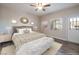 Main bedroom with a ceiling fan, exterior door, neutral color palette, and bright natural light at 6160 Rumrill St # 201, Las Vegas, NV 89113