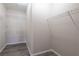 Spacious walk-in closet with wire shelving and gray wood-look floors at 6160 Rumrill St # 201, Las Vegas, NV 89113