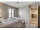 Serene bedroom with shuttered windows and direct access to the home office via an adjacent door at 6859 Crimson Shadow St, North Las Vegas, NV 89086