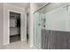 Modern bathroom showcasing a glass shower, with walk-in closet and toilet in the background at 703 Sleeping City Ave, Henderson, NV 89015