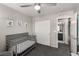 Well-lit Bedroom with a crib, closet, and access to the ensuite bathroom at 703 Sleeping City Ave, Henderson, NV 89015