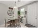 Inviting dining area features a round table with four chairs and stylish decor at 703 Sleeping City Ave, Henderson, NV 89015