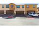 Exterior view of townhomes with garages, showcasing their architectural style and curb appeal at 703 Sleeping City Ave, Henderson, NV 89015