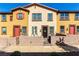 Charming townhome featuring a cozy walled front patio, colorful exteriors, and well-maintained landscaping at 703 Sleeping City Ave, Henderson, NV 89015