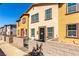 Attractive multi-colored townhome exterior, featuring a quaint patio and appealing architectural details at 703 Sleeping City Ave, Henderson, NV 89015