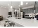Modern kitchen features a large island with a quartz countertop and stainless steel appliances at 703 Sleeping City Ave, Henderson, NV 89015