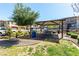 Picnic area under shade with tables, grass, and landscaping at 703 Sleeping City Ave, Henderson, NV 89015