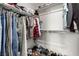 This walk-in closet has organizational racks and shelves for clothes and shoes at 703 Sleeping City Ave, Henderson, NV 89015