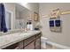 Bathroom with single vanity and large mirror at 7333 Night Sky St, North Las Vegas, NV 89084