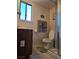 Functional bathroom features a toilet, vanity, and a glass-enclosed shower at 741 Bourbon St # E3, Pahrump, NV 89048