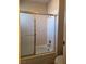 Bathroom featuring a shower and tub combo with sliding glass door at 741 Bourbon St # E3, Pahrump, NV 89048