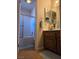 Bathroom with sliding glass shower door and single sink vanity at 741 Bourbon St # E3, Pahrump, NV 89048