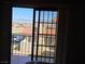 Bedroom with sliding glass door leading to an outdoor patio area at 741 Bourbon St # E3, Pahrump, NV 89048