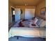Bedroom featuring a neutral color scheme and standard closet at 741 Bourbon St # E3, Pahrump, NV 89048
