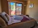 Bedroom featuring a walkout to the exterior balcony at 741 Bourbon St # E3, Pahrump, NV 89048