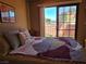 Bedroom featuring a walkout to the exterior balcony at 741 Bourbon St # E3, Pahrump, NV 89048