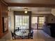 Cozy dining area with glass table, four chairs, and backyard views at 741 Bourbon St # E3, Pahrump, NV 89048