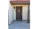 Inviting brown front door with secure screen door and a classic brown trim at 741 Bourbon St # E3, Pahrump, NV 89048