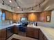 Well-lit kitchen featuring stainless steel appliances, warm wood cabinets, and tiled countertops at 741 Bourbon St # E3, Pahrump, NV 89048