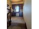 Stair landing with a built-in desk and cabinet nook featuring natural light at 741 Bourbon St # E3, Pahrump, NV 89048