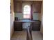Charming office nook with built-in desk and storage cabinets located at the top of stairs at 741 Bourbon St # E3, Pahrump, NV 89048