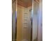 Corner shower unit with glass doors, built-in shelving, and neutral colored tiling at 741 Bourbon St # E3, Pahrump, NV 89048