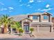 Two story home with a well manicured front yard and a two car garage at 7520 Jacaranda Bay St, Las Vegas, NV 89139