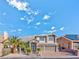 Two story home with a well manicured front yard and a two car garage at 7520 Jacaranda Bay St, Las Vegas, NV 89139