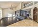 Open living room with a chandelier, high ceilings, and hardwood floors at 7520 Jacaranda Bay St, Las Vegas, NV 89139