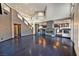 Spacious living room with hardwood floors, fireplace and easy access to kitchen with modern fixtures at 7520 Jacaranda Bay St, Las Vegas, NV 89139