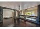 Open living room with stone accent and dark hardwood floors at 7520 Jacaranda Bay St, Las Vegas, NV 89139