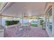 Covered patio with ceiling fan, pavers, and a view of the pool and the backyard area at 7520 Jacaranda Bay St, Las Vegas, NV 89139